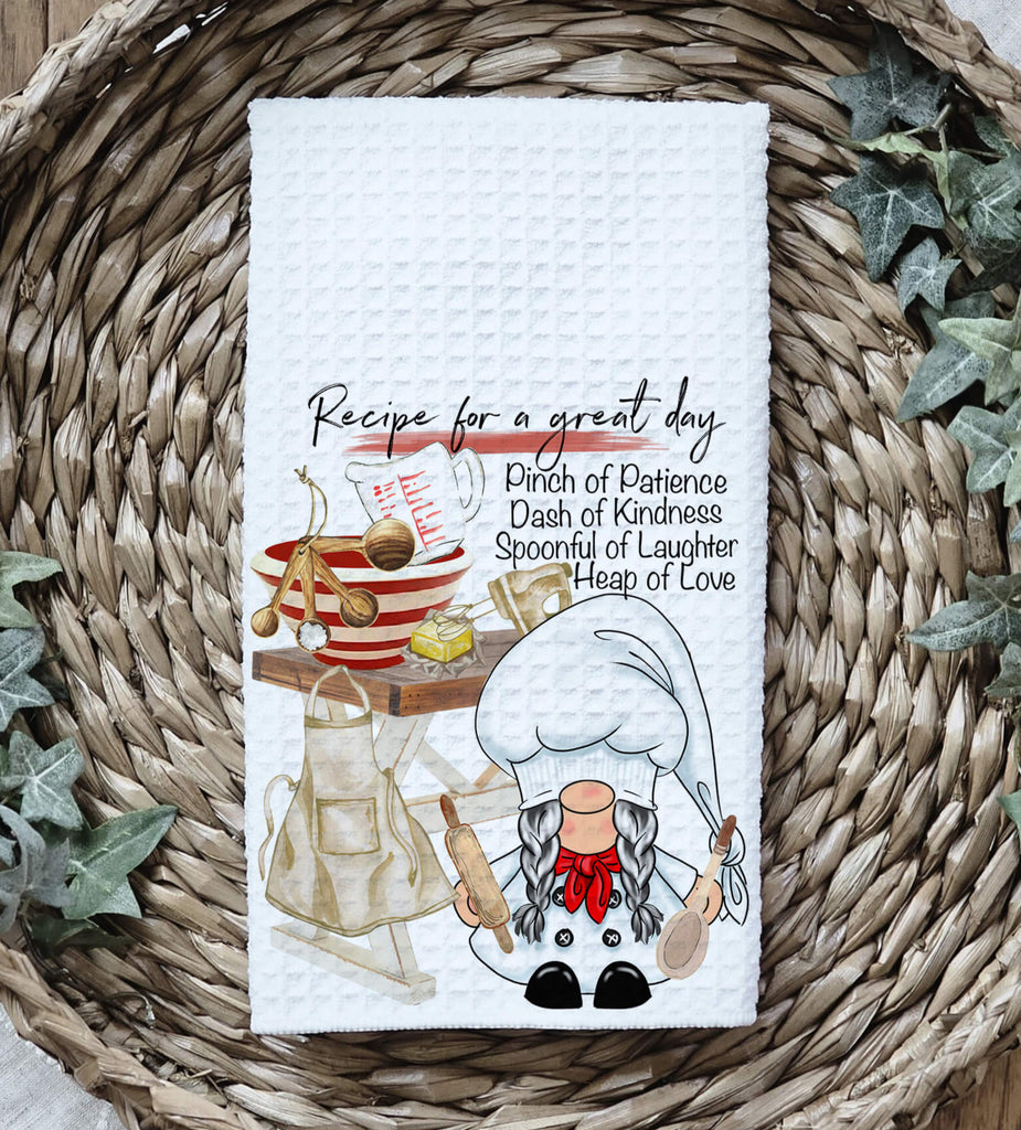 Adorable Recipe Gnome Kitchen Towel featuring a whimsical chef gnome, farmhouse baking setup, and a heartwarming 'Recipe for a Great Day' design. Perfect for baking lovers, farmhouse kitchen decor, and unique cooking gifts - Personalized Kreation