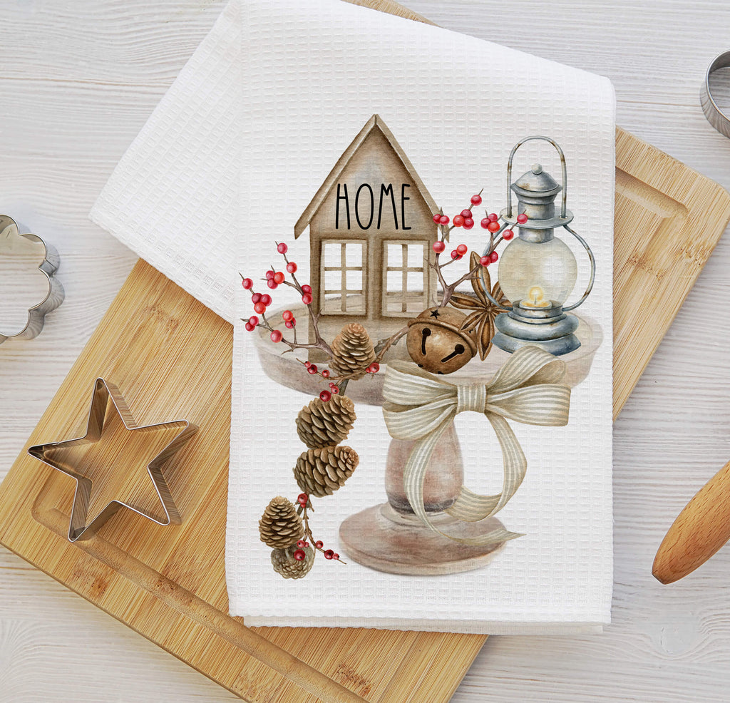 Rustic farmhouse kitchen towel featuring a cozy home design with pinecones, a lantern, and tiered tray décor. Perfect for vintage cottagecore and neutral country kitchen styling - Personalized Kreation