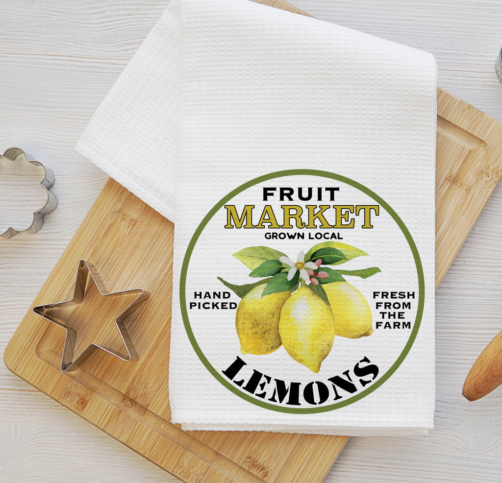 Farmhouse-style kitchen towel set featuring a vintage lemon market design. One towel showcases fresh lemons with 'Fruit Market' text, while the other displays a refreshing lemonade pitcher labeled 'Farmer’s Market.' Perfect for summer kitchen decor, farmhouse styling, and citrus-themed gifts - Personalized Kreation