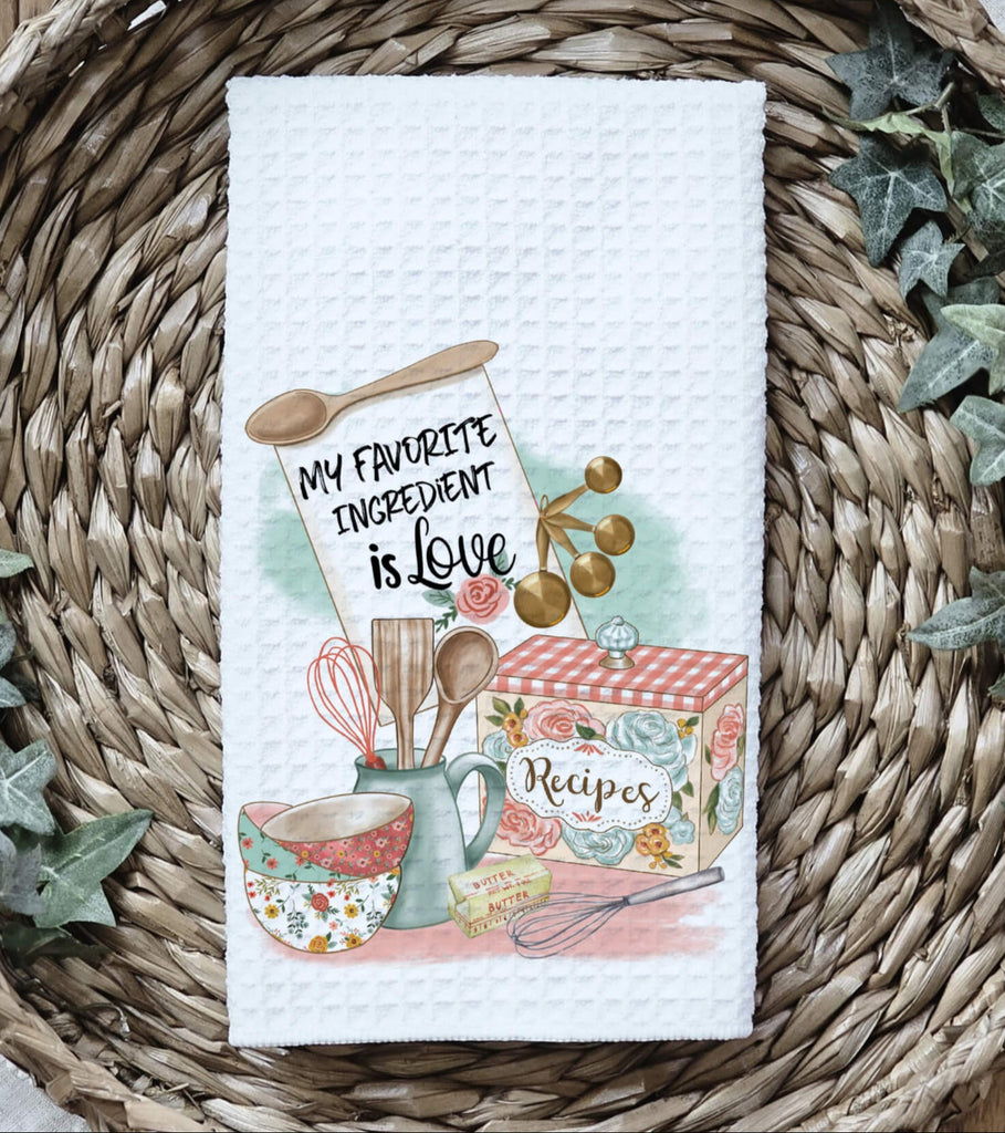 Floral kitchen towel with 'My Favorite Ingredient is Love' quote, featuring vintage baking utensils, recipe box, and farmhouse-style design. Absorbent waffle weave fabric, perfect for baking lovers, farmhouse kitchens, and heartfelt cooking gifts - Personalized Kreation