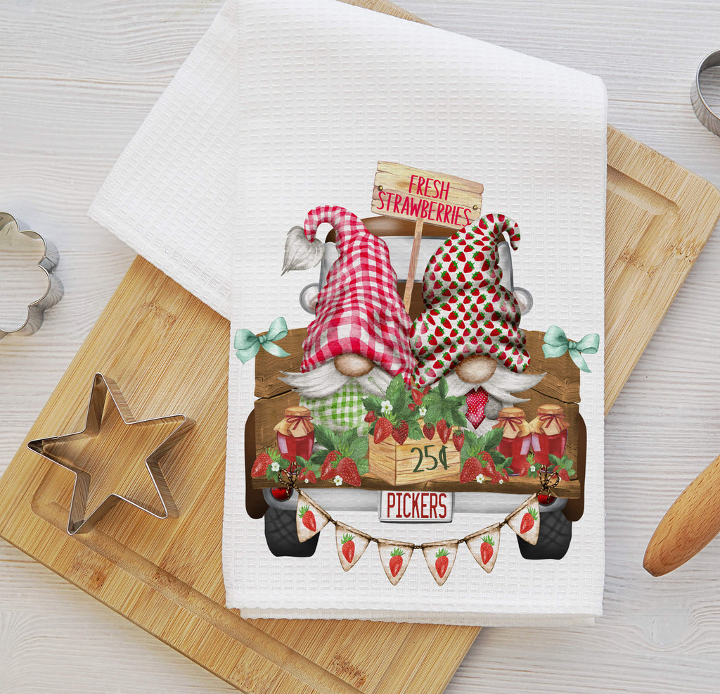 Strawberry Picker Gnome kitchen towel featuring two adorable gnomes in strawberry-themed hats with a rustic farm truck, fresh berry baskets, and farmhouse decor, perfect for country kitchen accents and summer decor