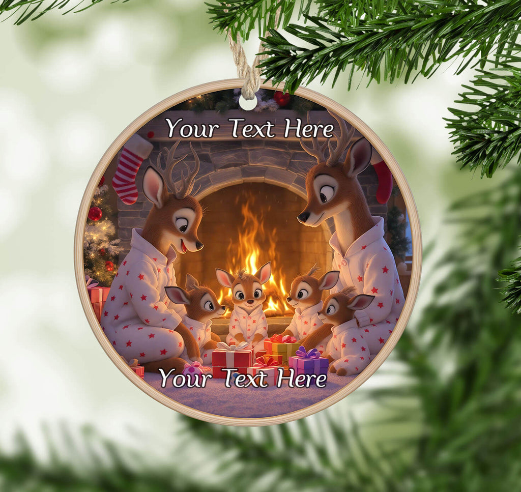 Personalizable Christmas ornament with cartoon deer family by a fireplace.