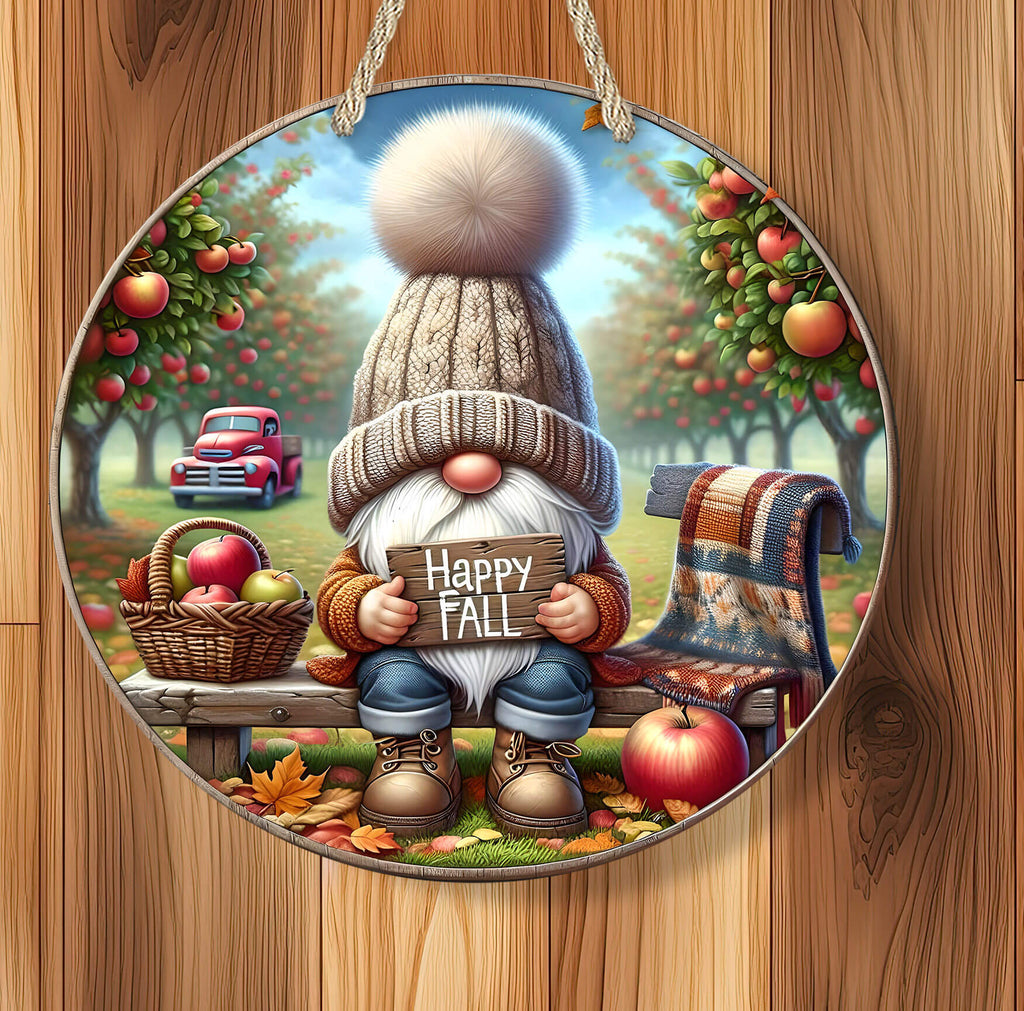 Decorative autumn scene with a gnome holding a 'Happy Fall' sign, surrounded by apples and a truck.