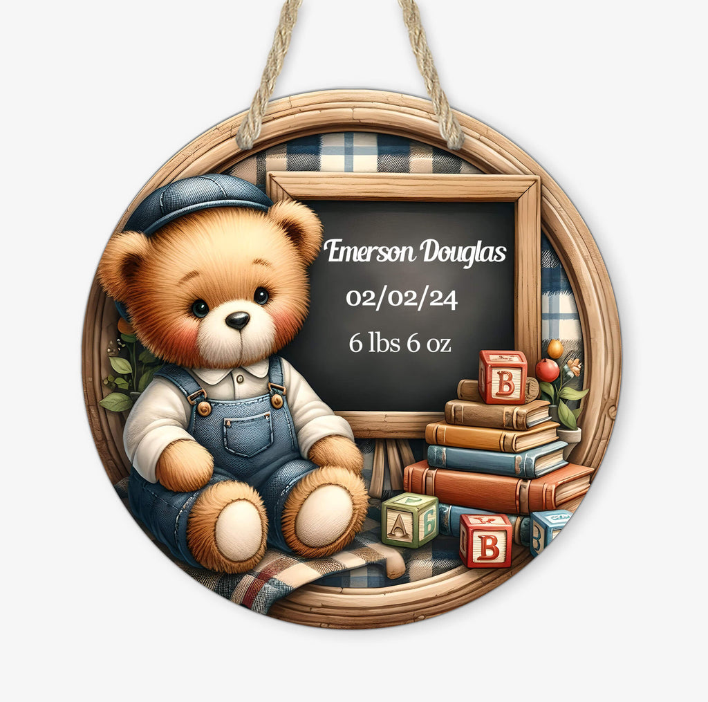 personalized baby boy birth announcement sign featuring a teddy bear in blue overalls sitting next to a chalkboard displaying baby's name, birth date, and weight. decorated with books, alphabet blocks, and a cozy plaid background, perfect for nursery decor or a newborn keepsake - Personalized Kreation