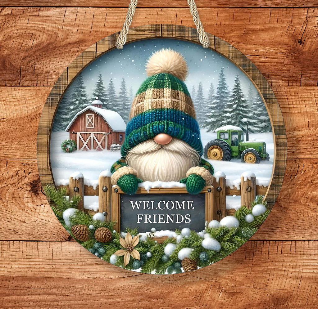 Decorative sign with a gnome, barn, and tractor in a snowy landscape on a wooden background.