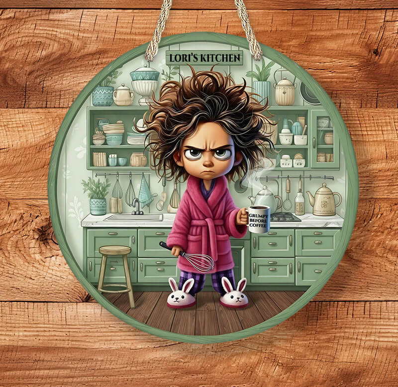 Circular sign with an illustration of a character in a kitchen, labeled 'Lori's Kitchen'.