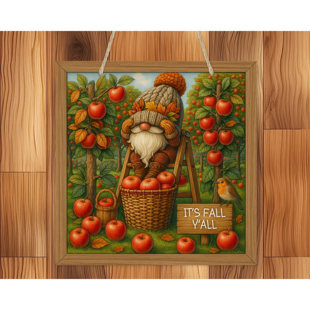 Decorative autumn-themed gnome with apples and a basket on a wooden background