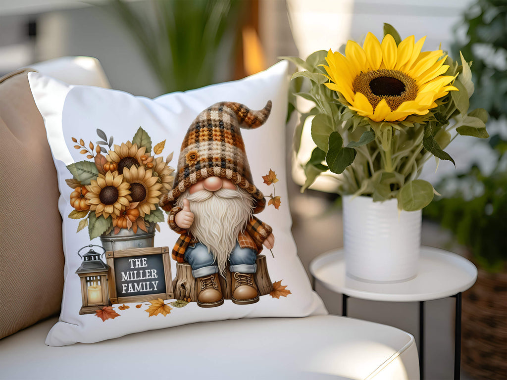 Fall pillow with gnome in plaid hat, sunflowers, pumpkins, rustic lantern, and 'Happy Fall Y’all' chalkboard sign on cream linen fabric