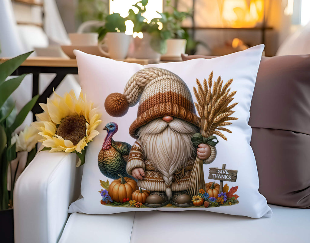 Decorative pillow with a gnome and autumn-themed design on a couch.