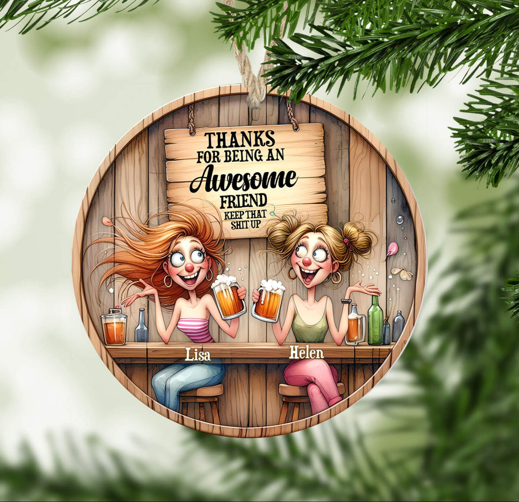 Circular ornament with cartoon characters and humorous text, framed by Christmas tree branches.