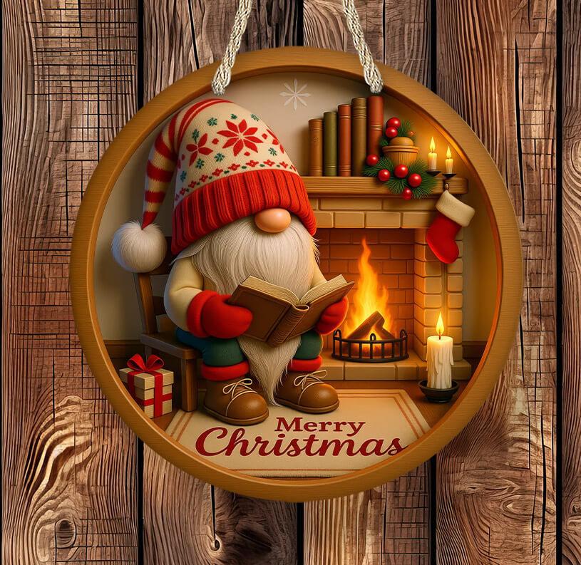 Decorative Christmas ornament with a gnome reading a book by a fireplace, on a wooden background.