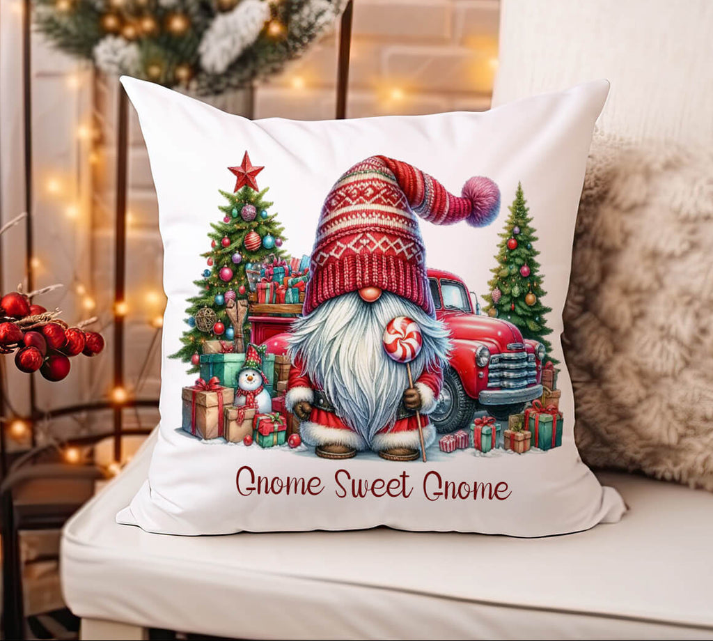 Decorative pillow with Christmas gnome and truck design on a couch.