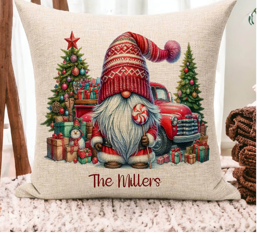 Decorative pillow with Christmas-themed design featuring a gnome, truck, and trees, with 'The Millers' text.
