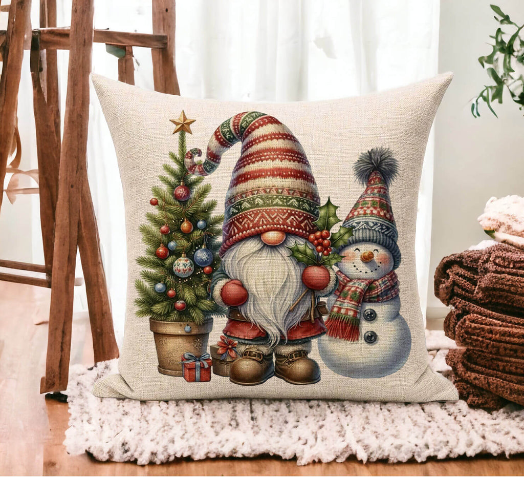 Decorative pillow with Christmas-themed design featuring a gnome and snowman on a wooden floor.