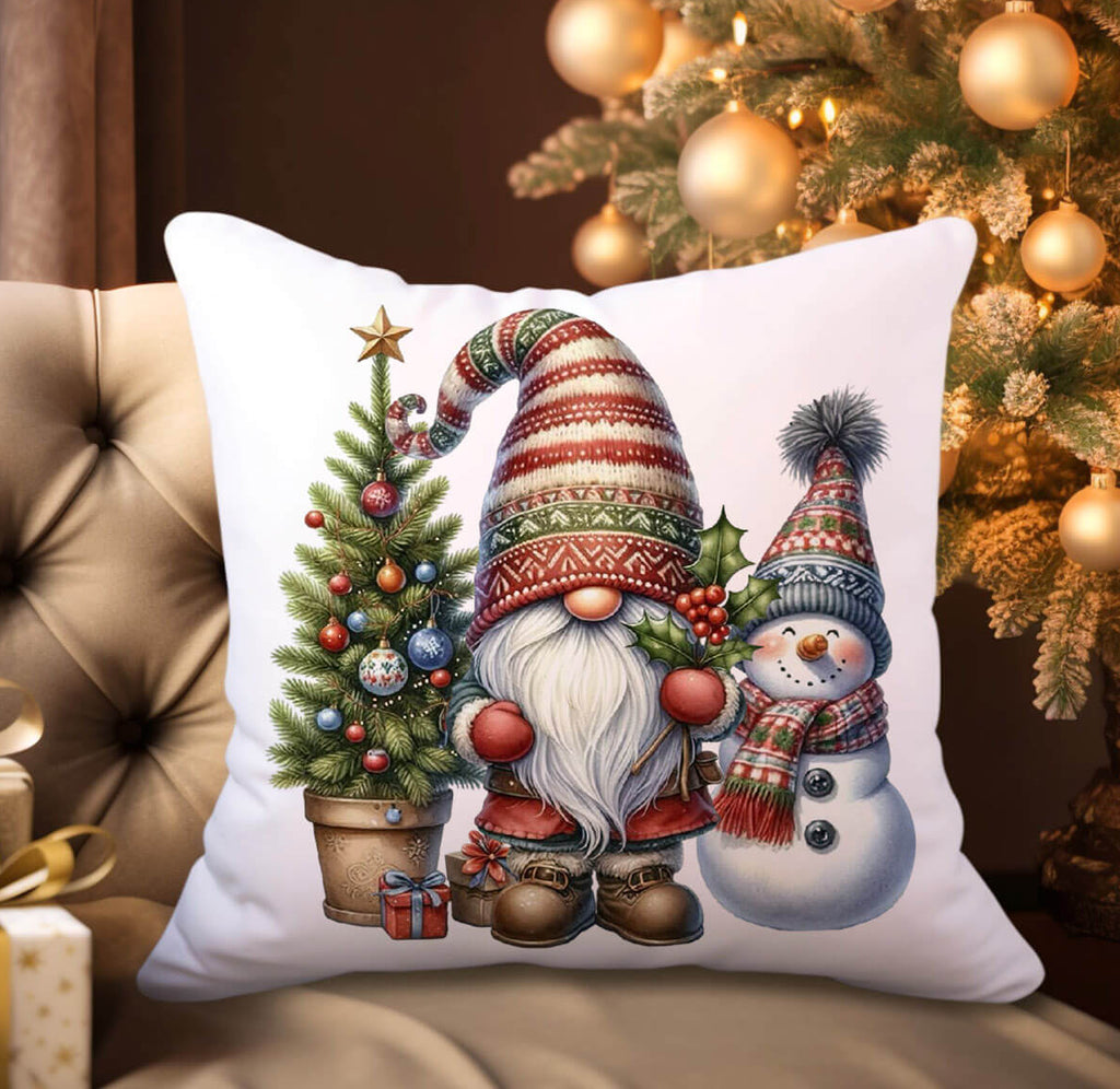 Decorative pillow with Christmas-themed design featuring a gnome and snowman in front of a decorated tree.