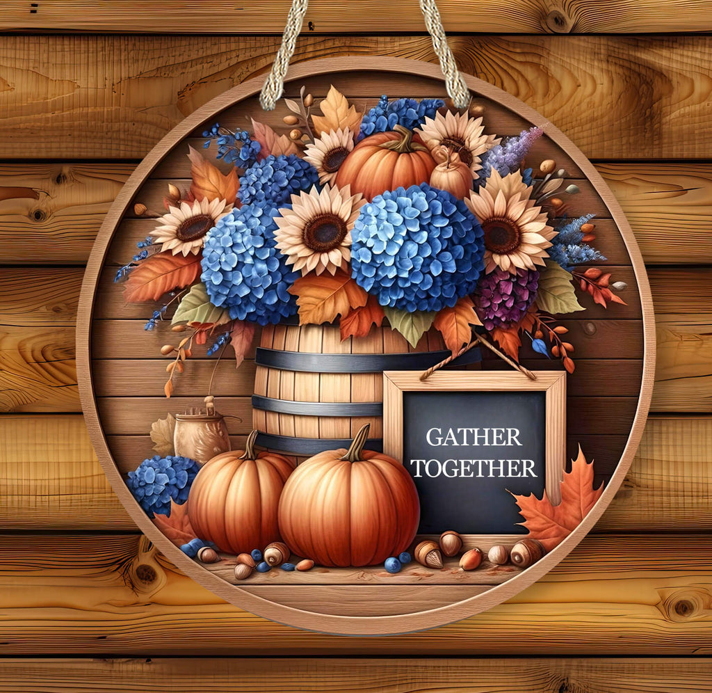 Decorative wall hanging with pumpkins, flowers, and a sign on a wooden background