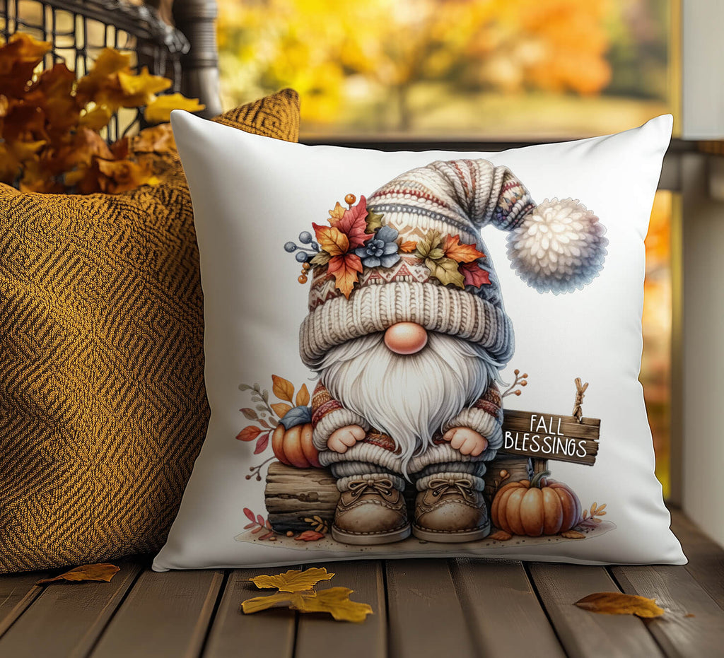Decorative pillow with a fall-themed gnome design on a wooden surface.
