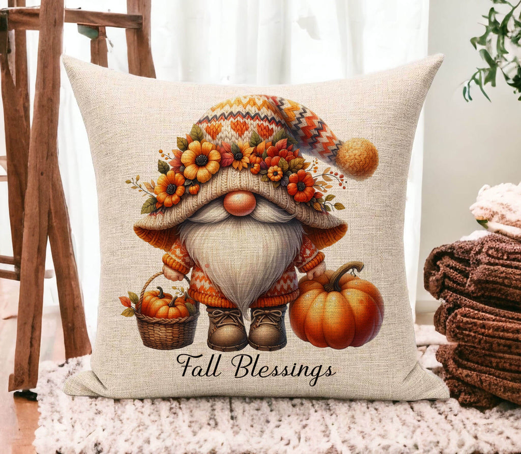 Decorative pillow with a gnome design and 'Fall Blessings' text on a soft surface.