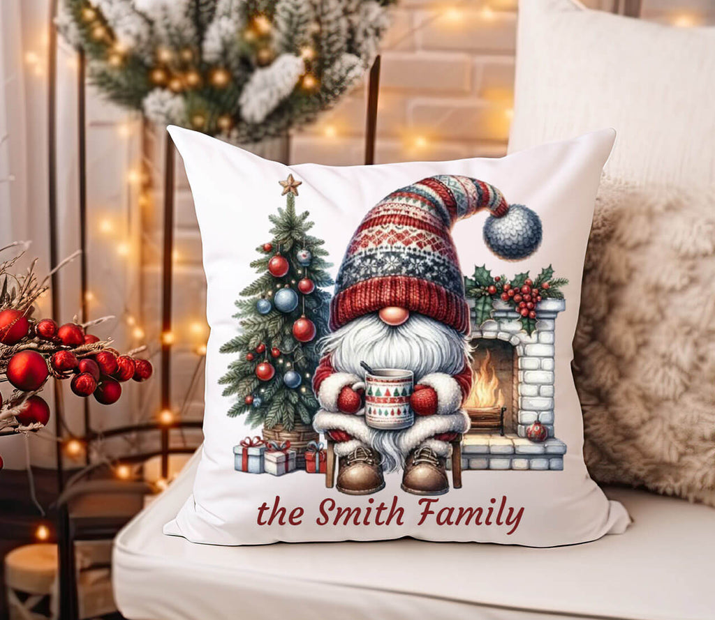 Decorative pillow with a Christmas gnome design and 'the Smith Family' text, placed on a couch with festive decorations.