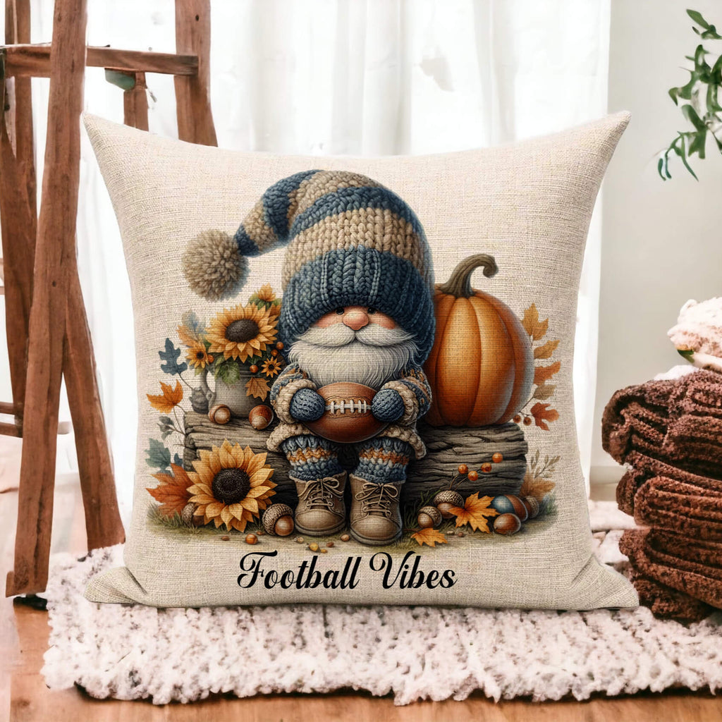 Decorative pillow with a gnome, sunflowers, and pumpkin design on a wooden floor.