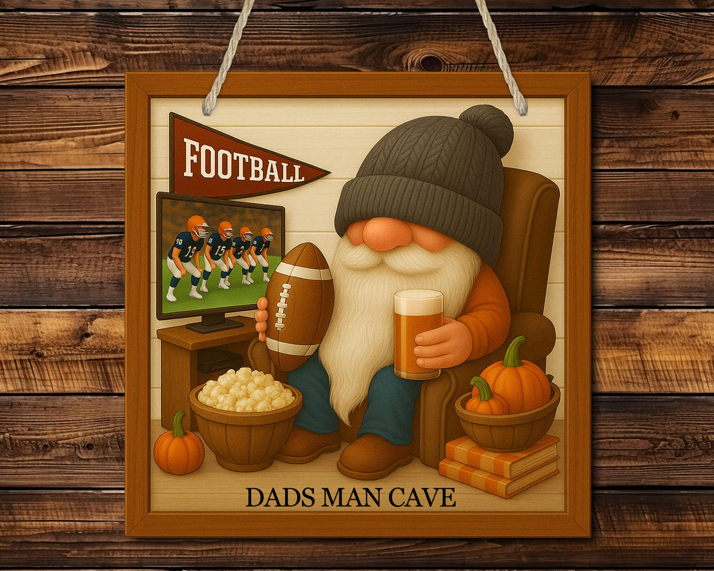 Gnome watching football on TV with a beer, surrounded by pumpkins and sports paraphernalia, on a wooden background.