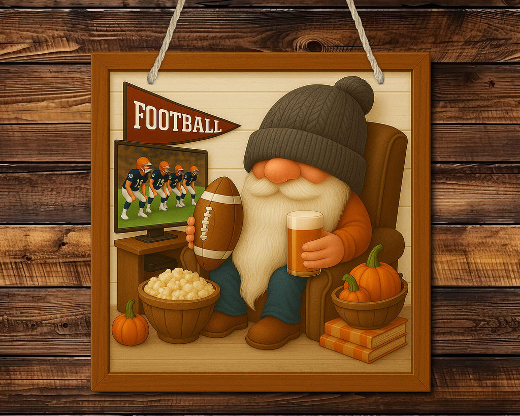 Gnome watching football on TV with a beer and popcorn, framed as a decorative piece.