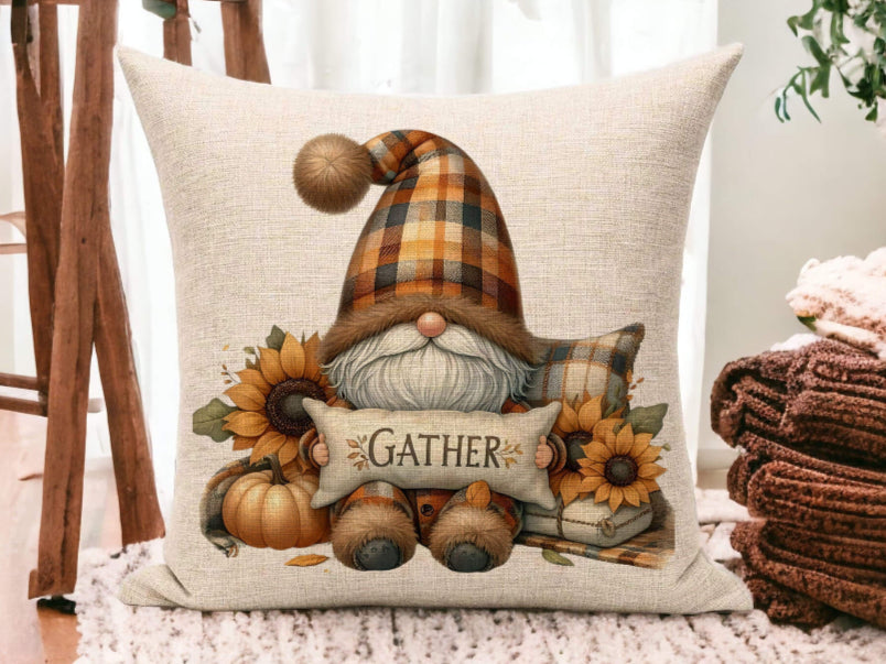 Decorative pillow with a gnome design and 'Gather' text on a wooden floor.