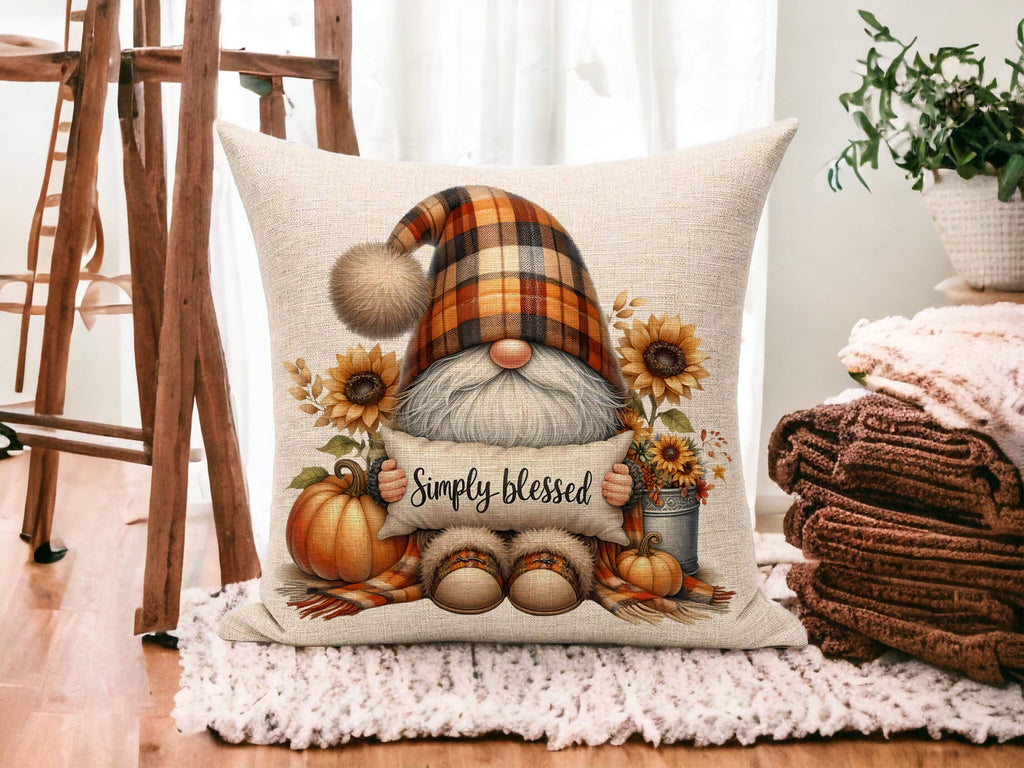 Decorative pillow with a gnome holding a sign saying 'Simply blessed' in a home setting.