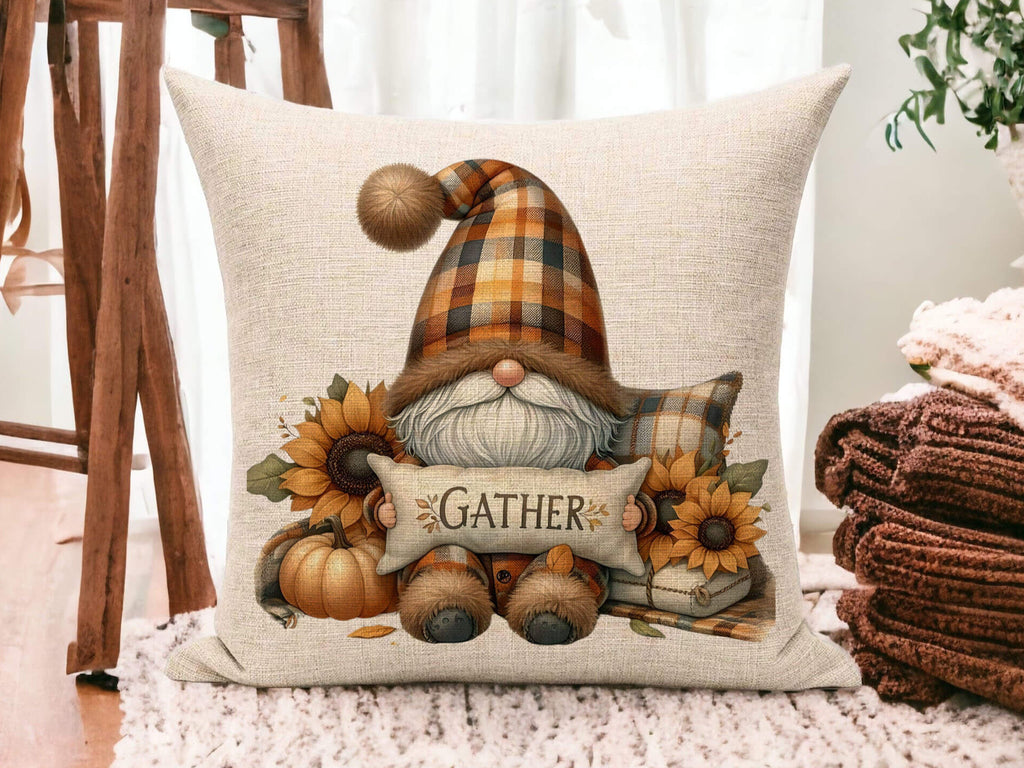 Decorative pillow with a gnome design and 'Gather' text on a wooden floor.