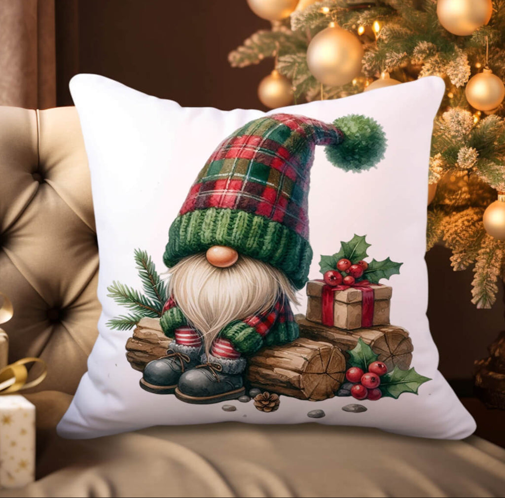 Decorative pillow with a Christmas gnome design in front of a decorated tree.