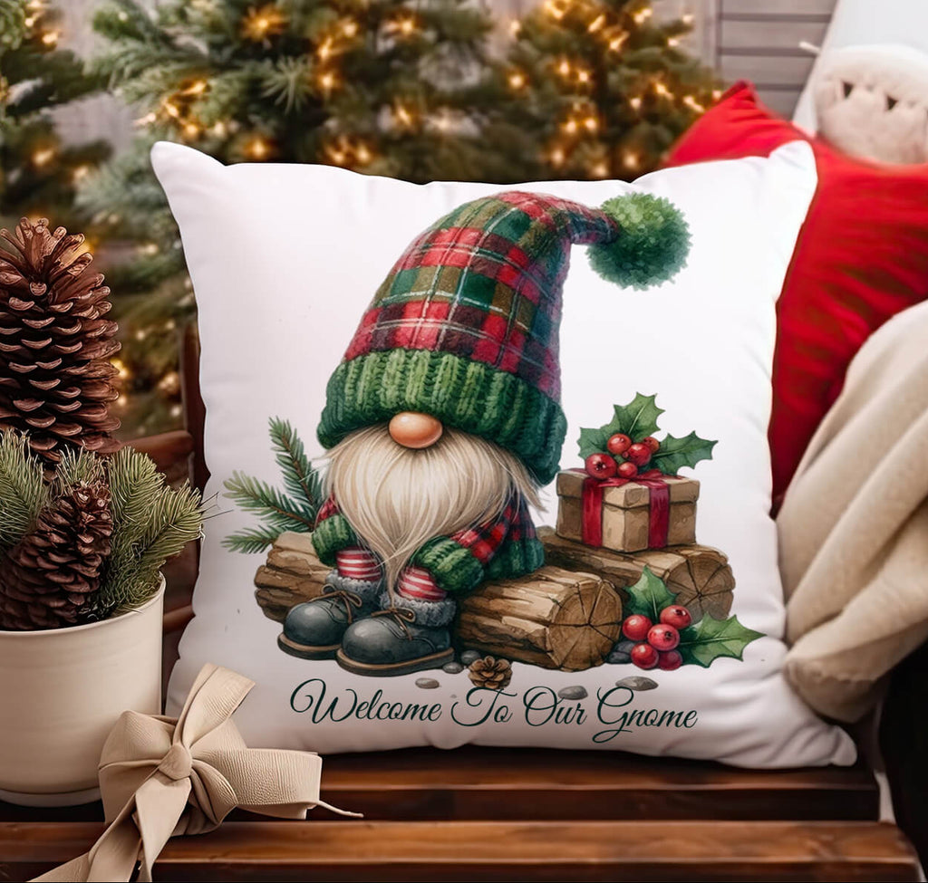 Decorative pillow with a gnome design in front of a Christmas tree.