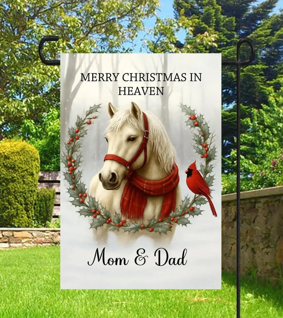 Garden flag with a horse, cardinal, and wreath design, featuring text 'Merry Christmas in Heaven Mom & Dad' against a natural background.