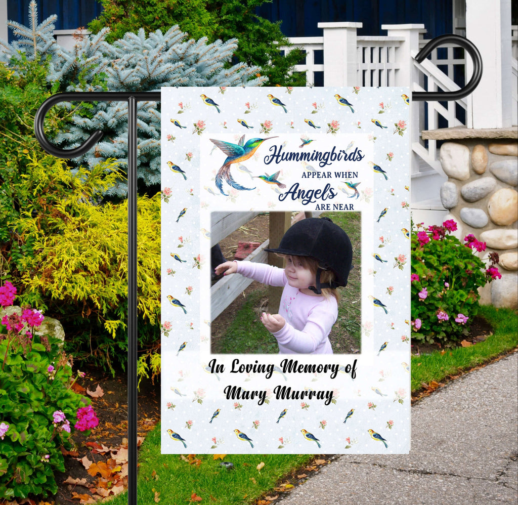 Custom hummingbird memorial garden flag featuring a personalized photo and heartfelt tribute. A beautiful outdoor remembrance decor piece honoring a lost loved one with a serene hummingbird and floral design - Personalized Kreation