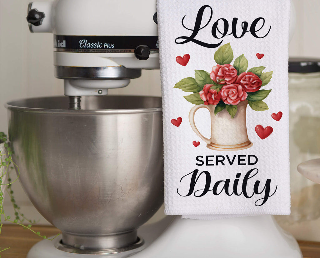 Love Served Daily kitchen towel with floral farmhouse pitcher and heart accents. Rustic Valentine’s dish towel, perfect for romantic home decor, housewarming gift, or gift for her. Soft, absorbent, machine washable, and stylish for any kitchen