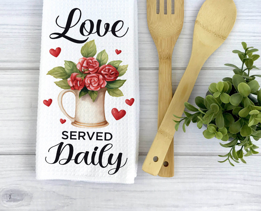 Love Served Daily kitchen towel with floral farmhouse pitcher and heart accents. Rustic Valentine’s dish towel, perfect for romantic home decor, housewarming gift, or gift for her. Soft, absorbent, machine washable, and stylish for any kitchen