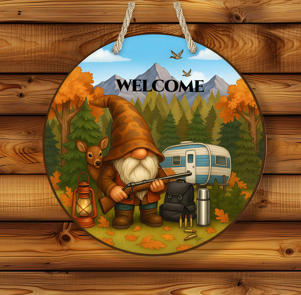 Decorative sign with a gnome, deer, and camper in an autumn forest scene on a wooden background.