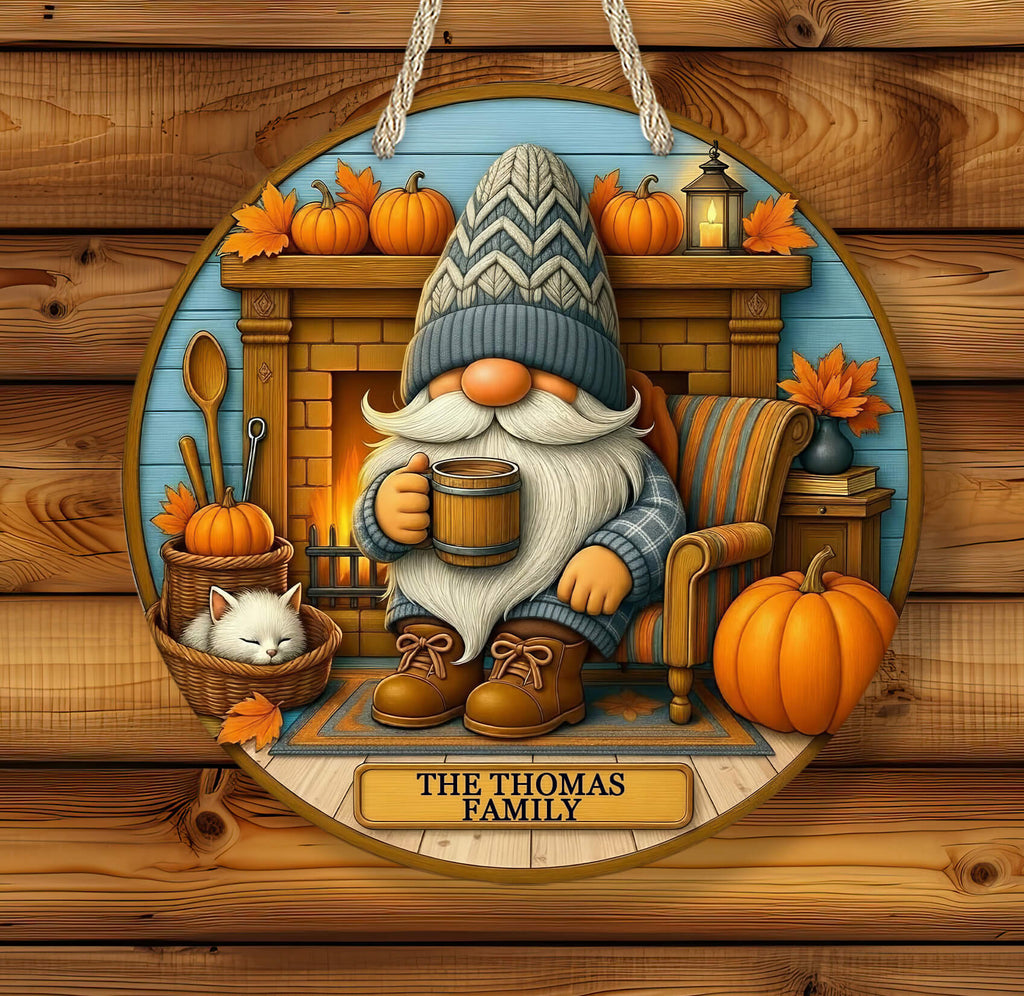 Decorative sign with a gnome, cat, and pumpkins on a wooden background
