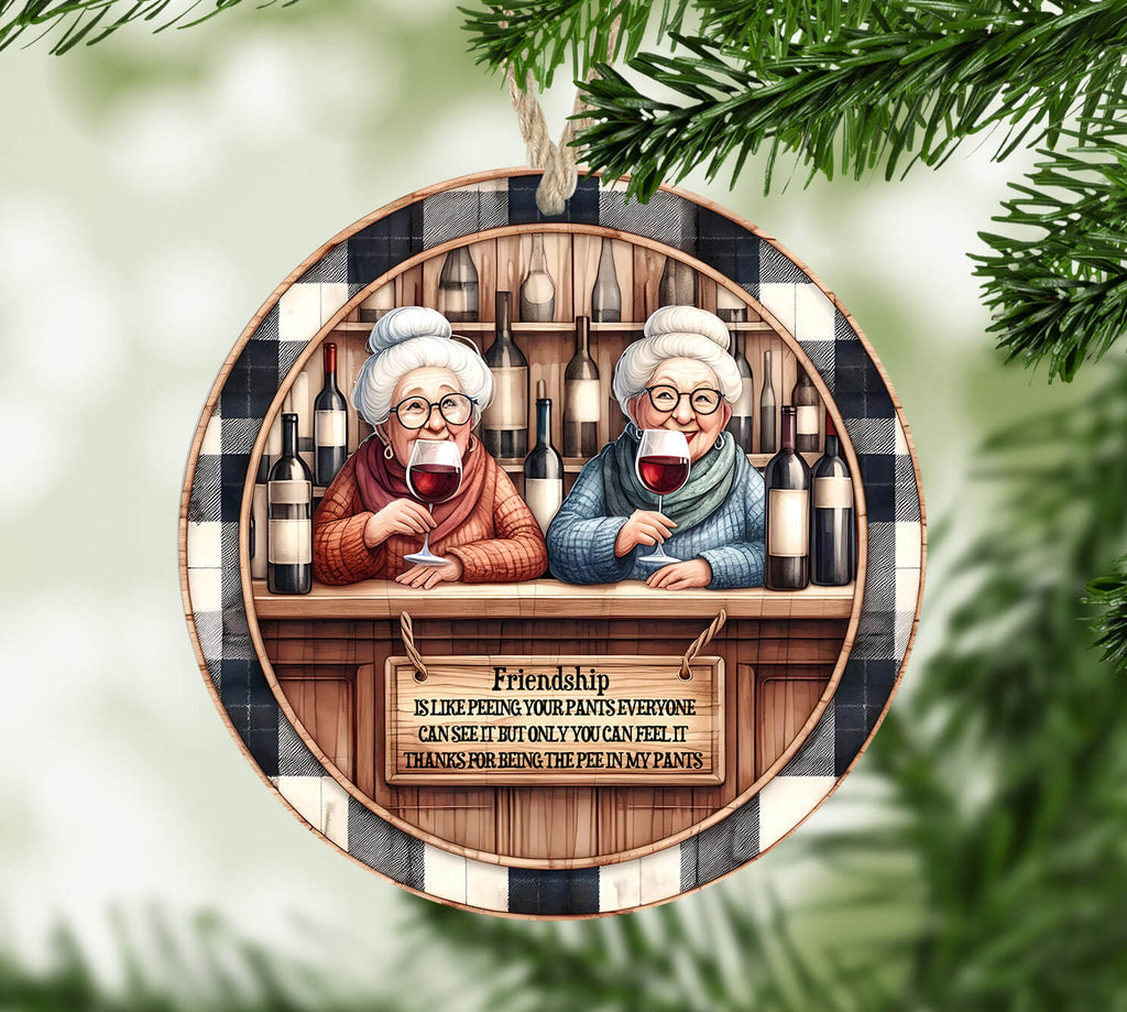 Decorative ornament with two elderly women at a bar, surrounded by wine bottles and a humorous quote.