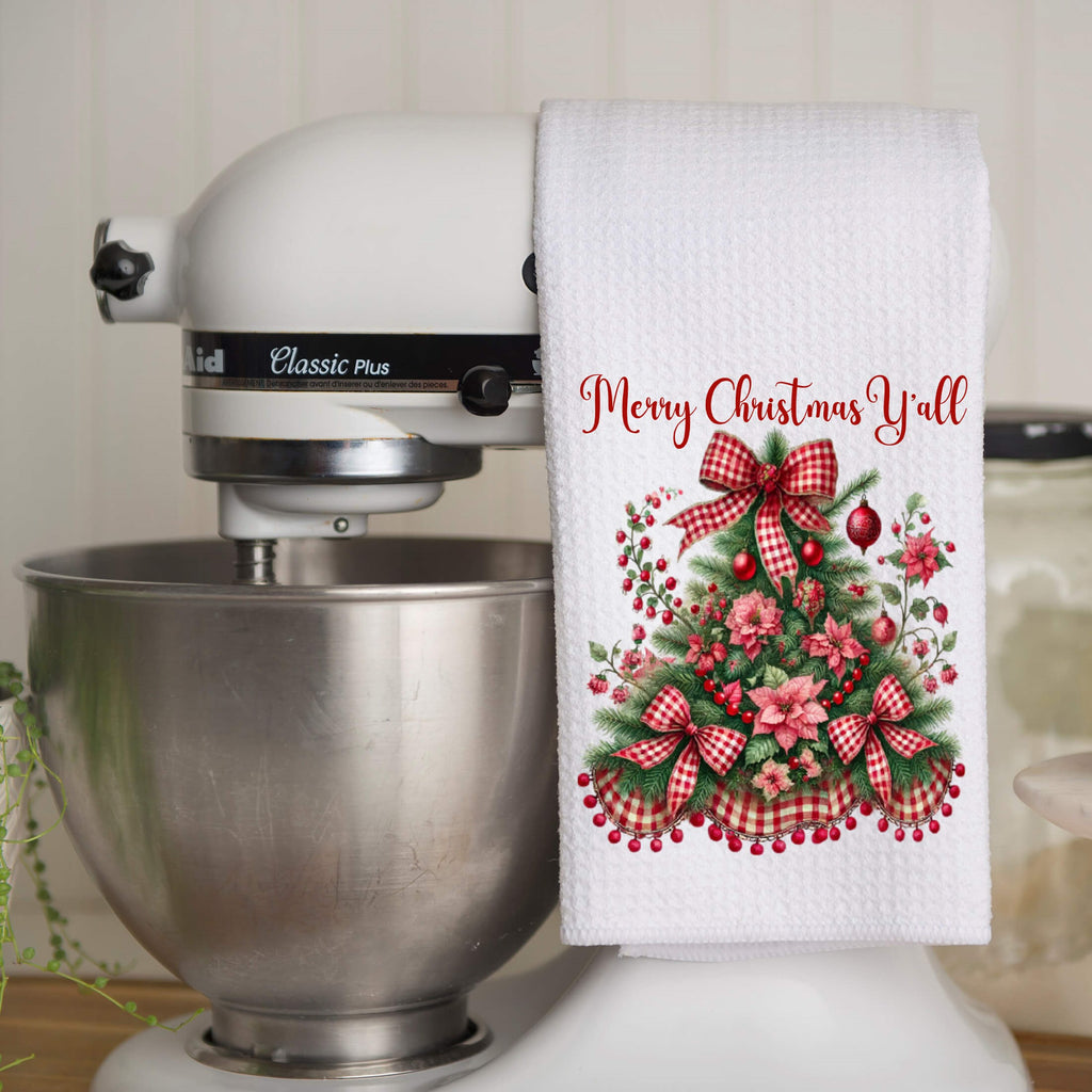 Festive Christmas kitchen towel featuring a beautifully decorated Christmas tree with red gingham bows, poinsettias, and holly berries. Made from high-quality microfiber waffle weave fabric, this absorbent and quick-drying towel adds a rustic farmhouse charm to holiday decor. Perfect for festive kitchen styling, holiday baking, and gifting - Personalized Kreation