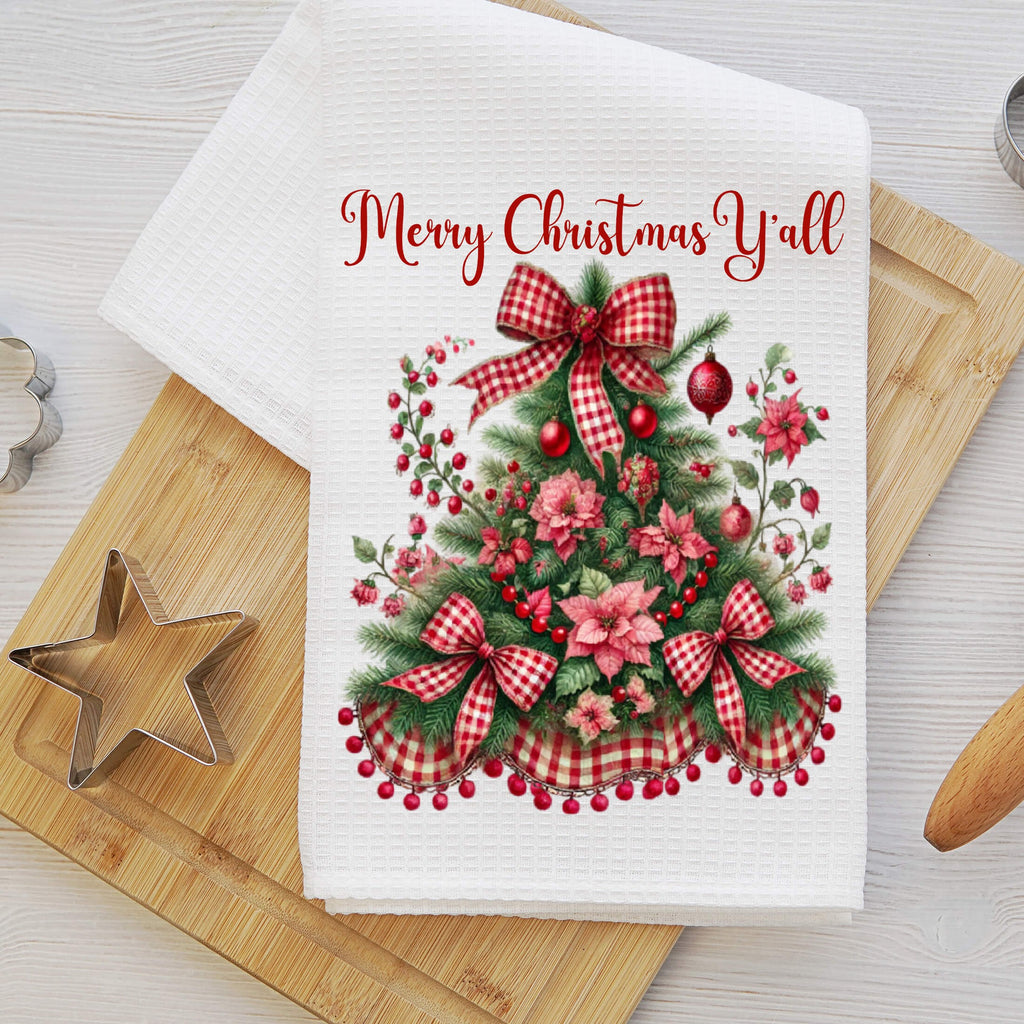 Festive Christmas kitchen towel featuring a beautifully decorated Christmas tree with red gingham bows, poinsettias, and holly berries. Made from high-quality microfiber waffle weave fabric, this absorbent and quick-drying towel adds a rustic farmhouse charm to holiday decor. Perfect for festive kitchen styling, holiday baking, and gifting