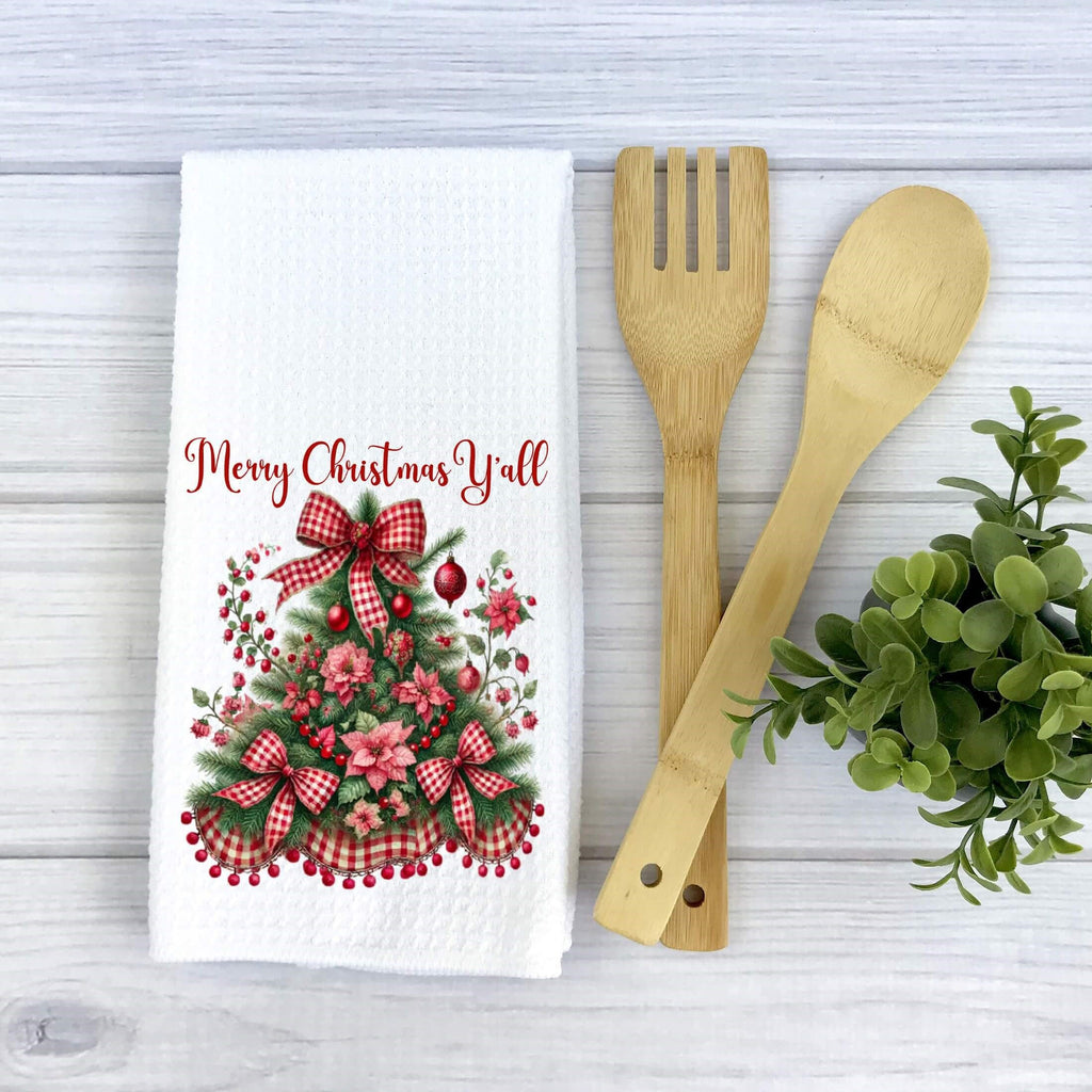 Festive Christmas kitchen towel featuring a beautifully decorated Christmas tree with red gingham bows, poinsettias, and holly berries. Made from high-quality microfiber waffle weave fabric, this absorbent and quick-drying towel adds a rustic farmhouse charm to holiday decor. Perfect for festive kitchen styling, holiday baking, and gifting