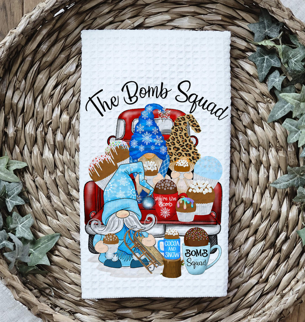Hot Cocoa Bomb Squad kitchen towel featuring winter gnomes, hot chocolate bombs, and festive holiday decor. Made from absorbent waffle weave fabric, perfect for Christmas baking, farmhouse kitchens, and cozy winter decorations - Personalized Kreation