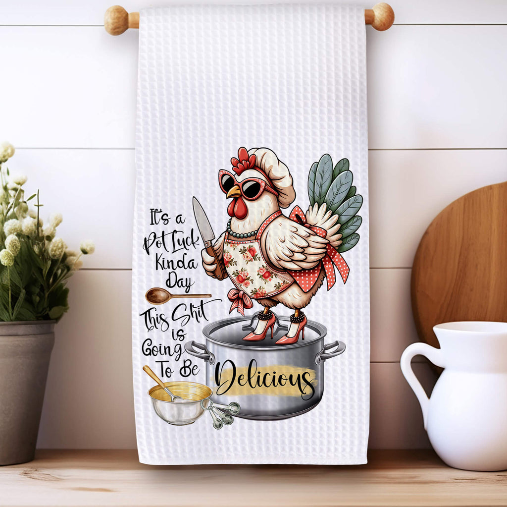 Funny Potluck Kitchen Towel featuring a stylish chicken chef standing on a pot, wearing sunglasses and an apron. Perfect for farmhouse kitchen decor, food lovers, and potluck gatherings. High-quality, absorbent, and machine washable dish towel for home and gift giving - Personalized Kreation