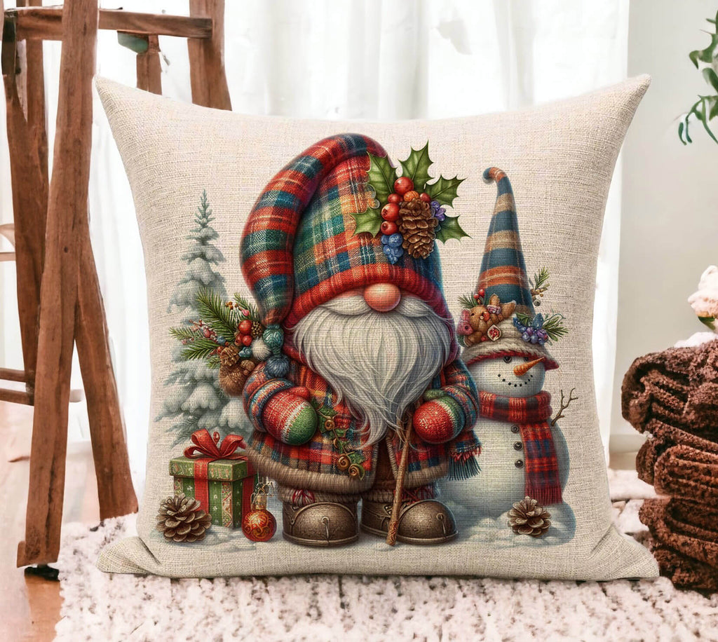 Decorative pillow with Christmas-themed design featuring a gnome and snowman.
