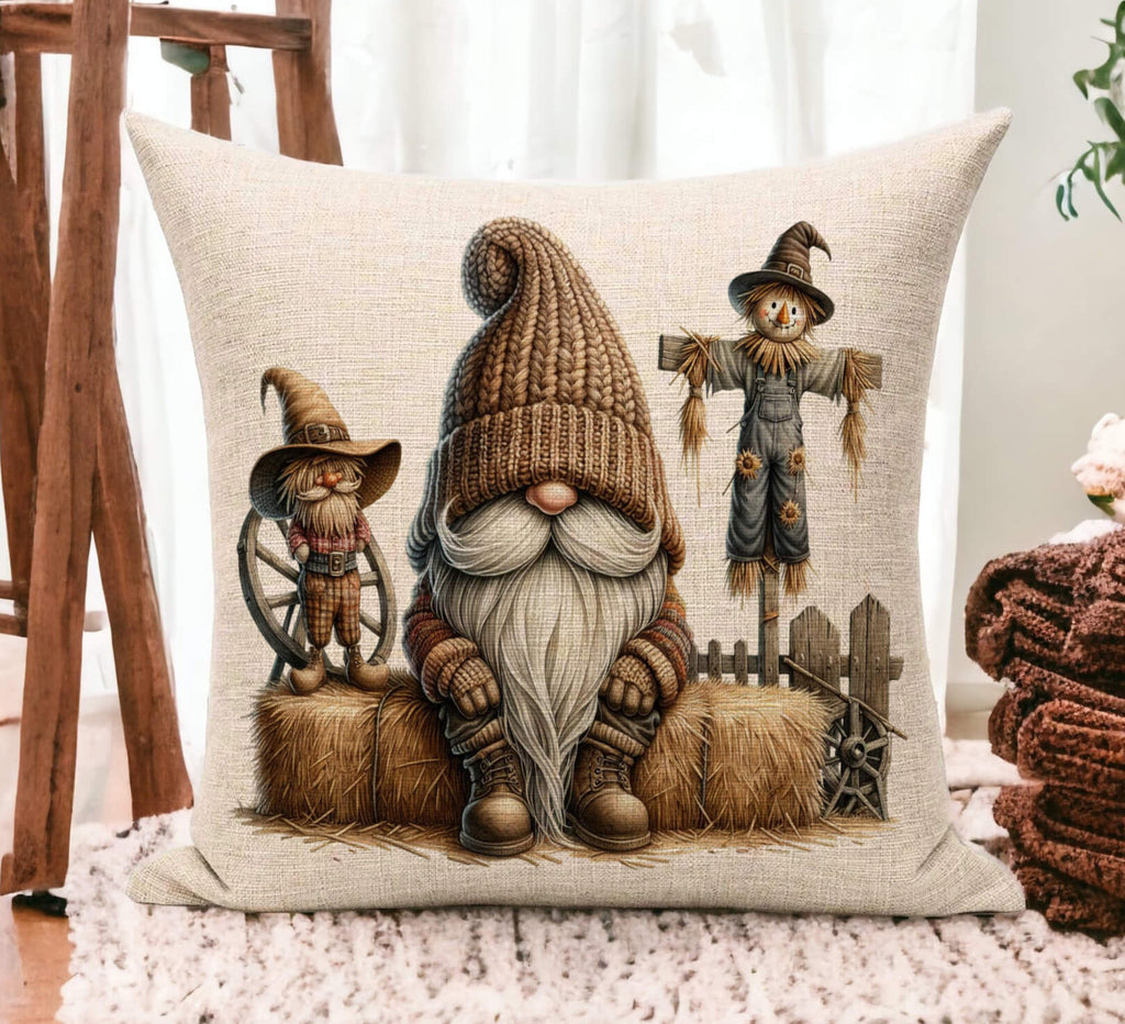 Decorative pillow with a gnome and scarecrow design on a wooden floor.