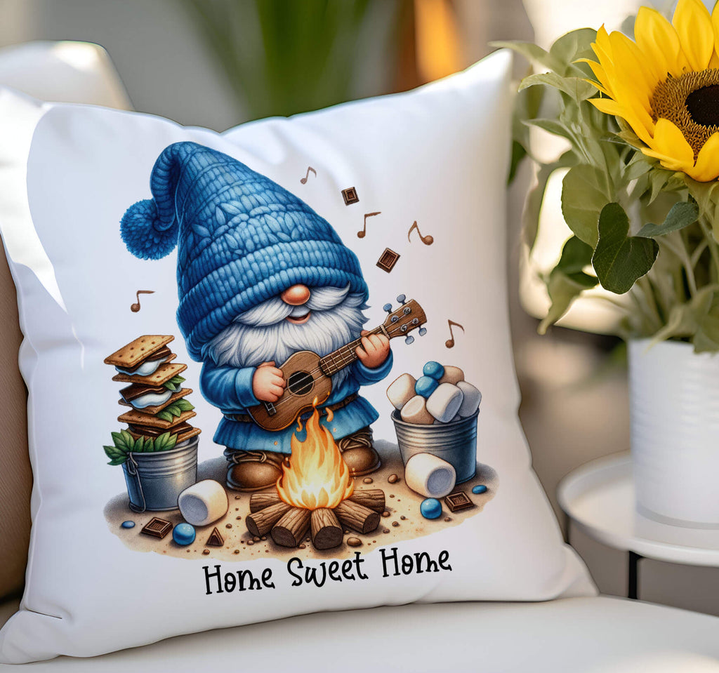 A personalized camping pillow featuring a cute gnome playing a guitar by a campfire, surrounded by marshmallows, chocolate, and s’mores ingredients. Available in 18x18 inches, white canvas or beige linen, with a hidden zipper closure. Perfect for camping lovers, rustic home decor, and cozy cabin retreats - Personalized Kreation