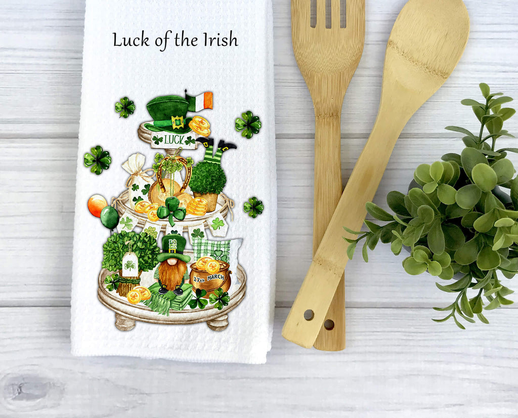 St. Patrick’s Day kitchen towel with tiered tray design featuring shamrocks, leprechaun, gold coins, and festive Irish decor. Perfect farmhouse kitchen decor or lucky holiday gift. Personalized St. Patrick’s Day tea towel for home and celebrations