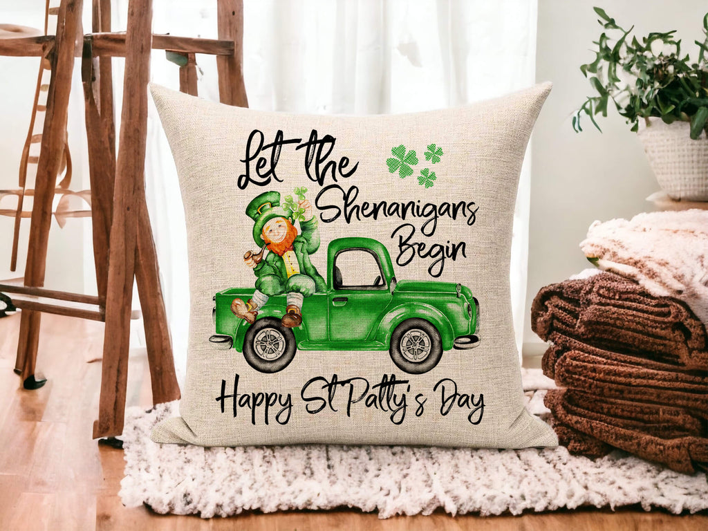 St. Patrick’s Day decorative pillow featuring a green vintage truck with a leprechaun, shamrocks, and festive "Let the Shenanigans Begin" text on a linen or canvas throw pillow. Perfect for Irish-themed home decor, farmhouse style, and holiday celebrations