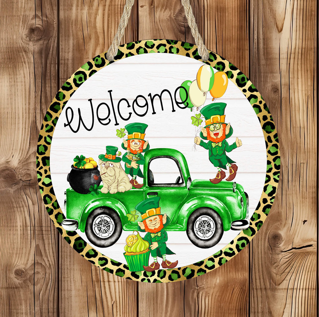 St. Patrick’s Day Welcome Sign featuring a green truck with leprechauns, shamrocks, gold coins, and a lucky cat. Round wooden door hanger with leopard print border, perfect for Irish home decor, front porch, or entryway. Festive holiday decoration for St. Paddy’s Day - Personalized Kreation