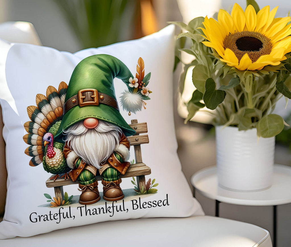 Decorative pillow with a gnome and turkey design on a chair with a sunflower in the background.